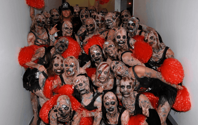 Backstage group photo of Weta Workshop zombie cheerleader performers with Bret Michaels at Rock2Wgtn.